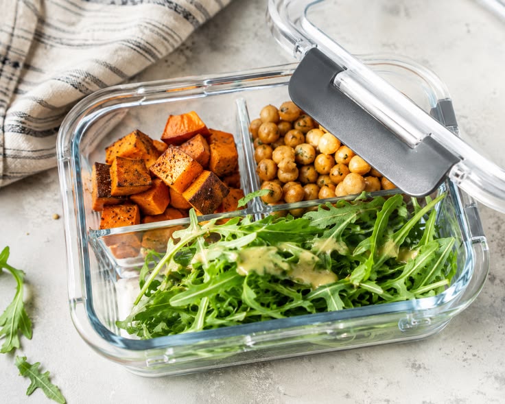 Organized meal prep containers with grains and vegetables